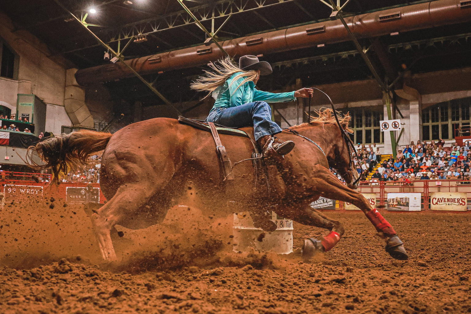 Mindy Holloway professional barrel racer running barrels. 