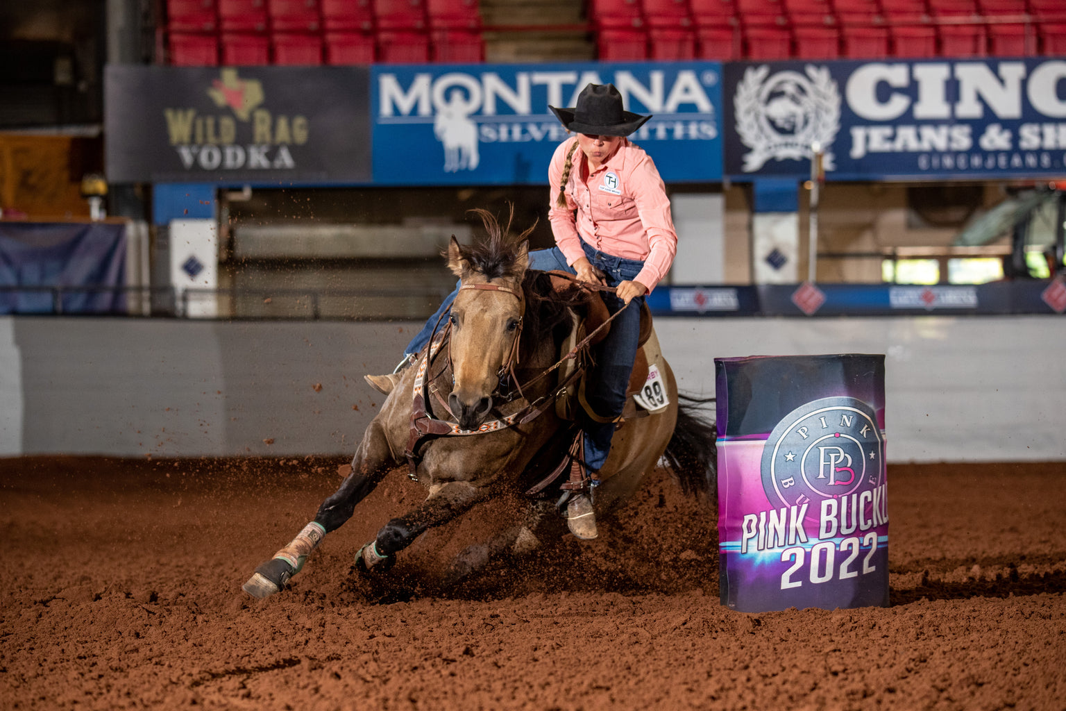 Professional Barrel Racer running barrels